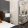 a bedroom with a mirror and a bed